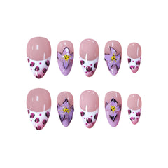 Medium almond press-on nails with pink floral designs, white French tips, and leopard print accents.