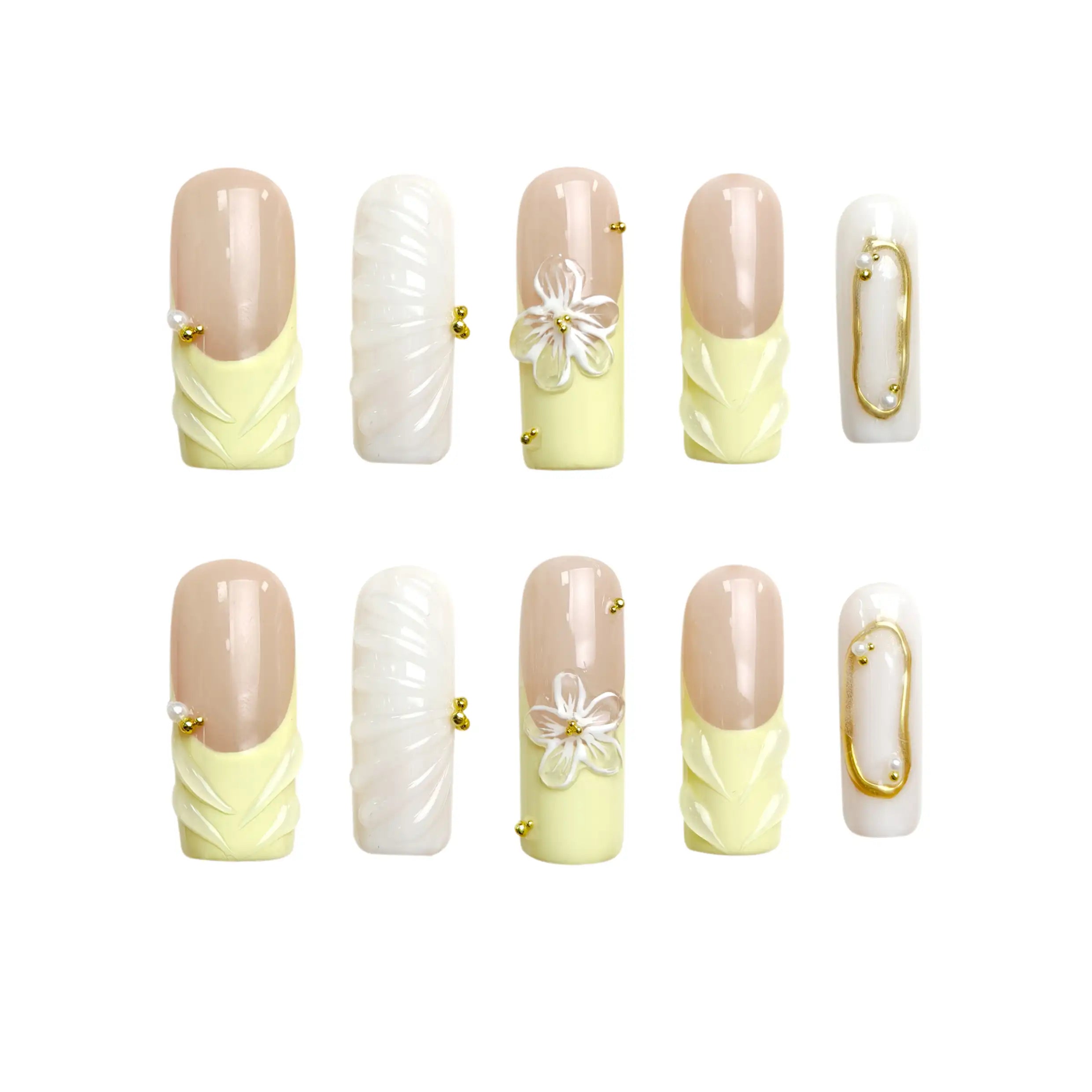 Coffin press on nails in butter yellow and white with 3D flower accents.