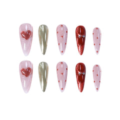 Handmade long stiletto press-on nails featuring shimmering pink, red glitter, gold chrome, and 3D heart accents for a playful, glamorous look.