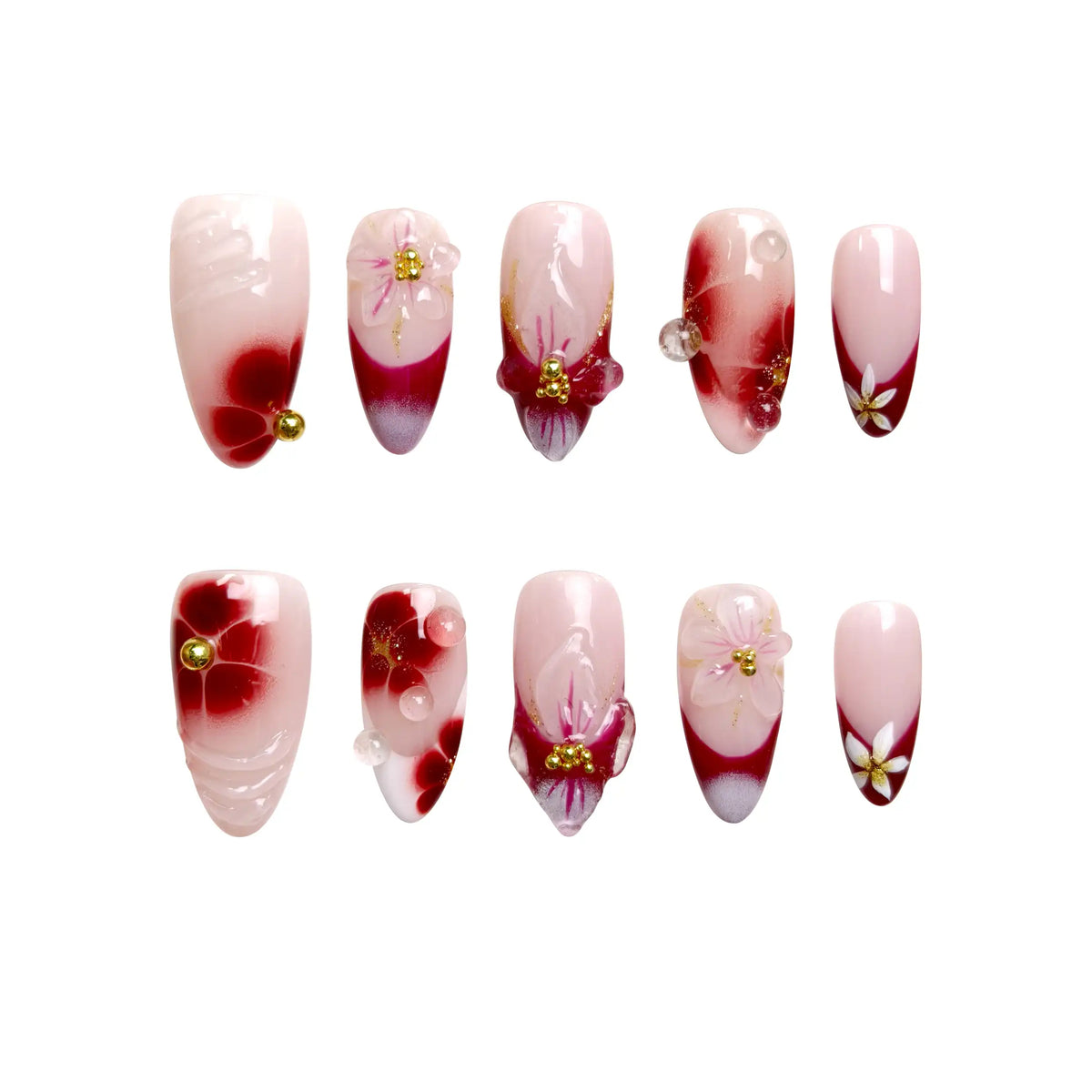 Red almond press on nails featuring flower designs and rhinestone accents.