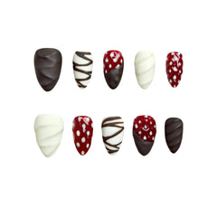 Medium almond press on nails with matte brown swirls, white twists, and strawberry accents.