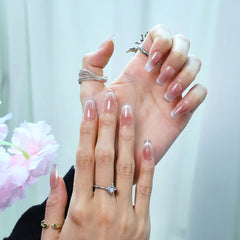 Natural light photo of glitter fade nude press-on nails