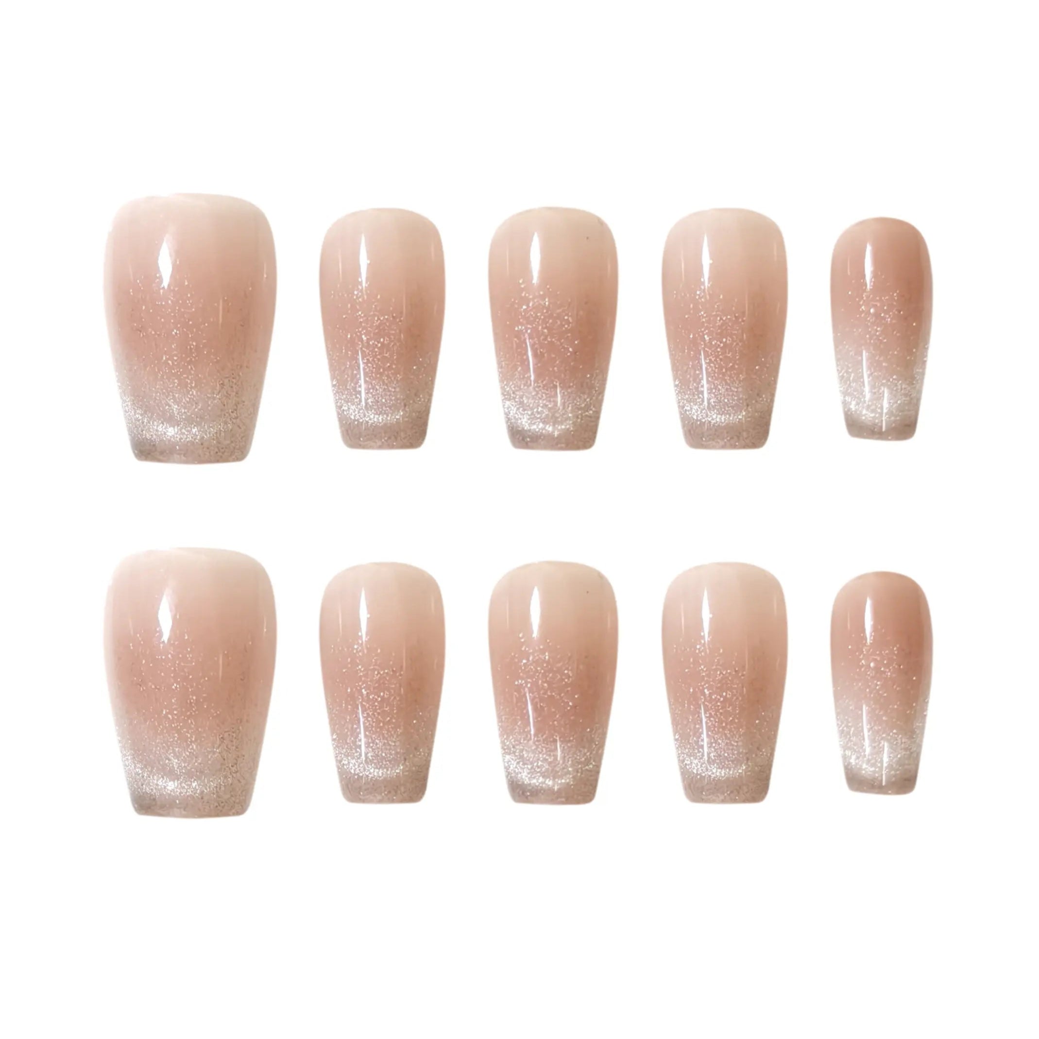 Nude squoval press-on nails with glitter ombré fade, combining french-tip style with subtle shimmer for summer elegance.