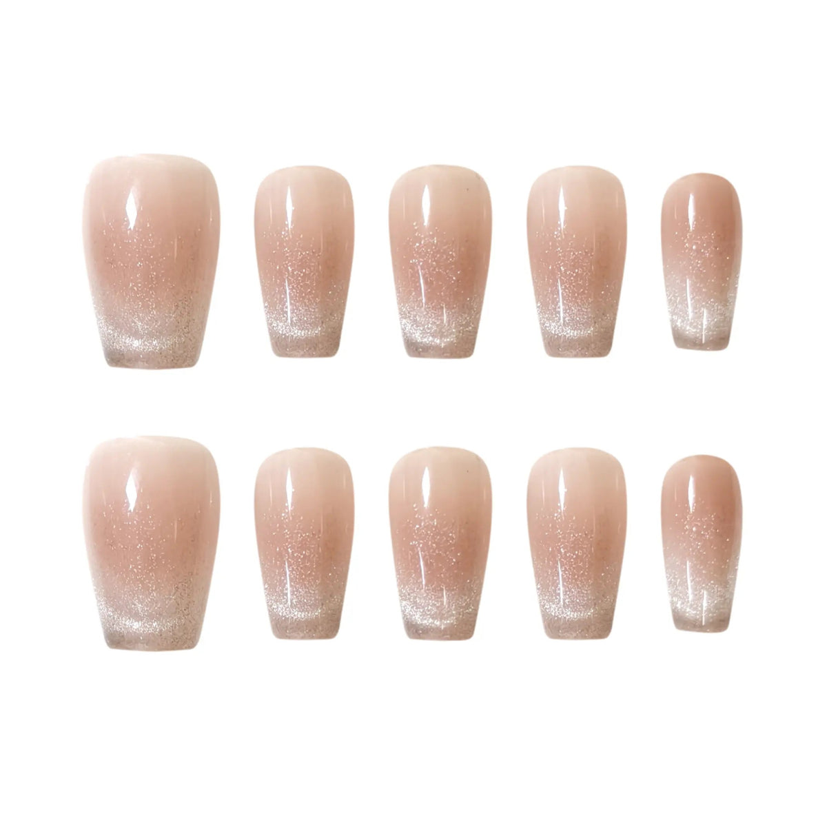 Nude squoval press-on nails with glitter ombré fade, combining french-tip style with subtle shimmer for summer elegance.