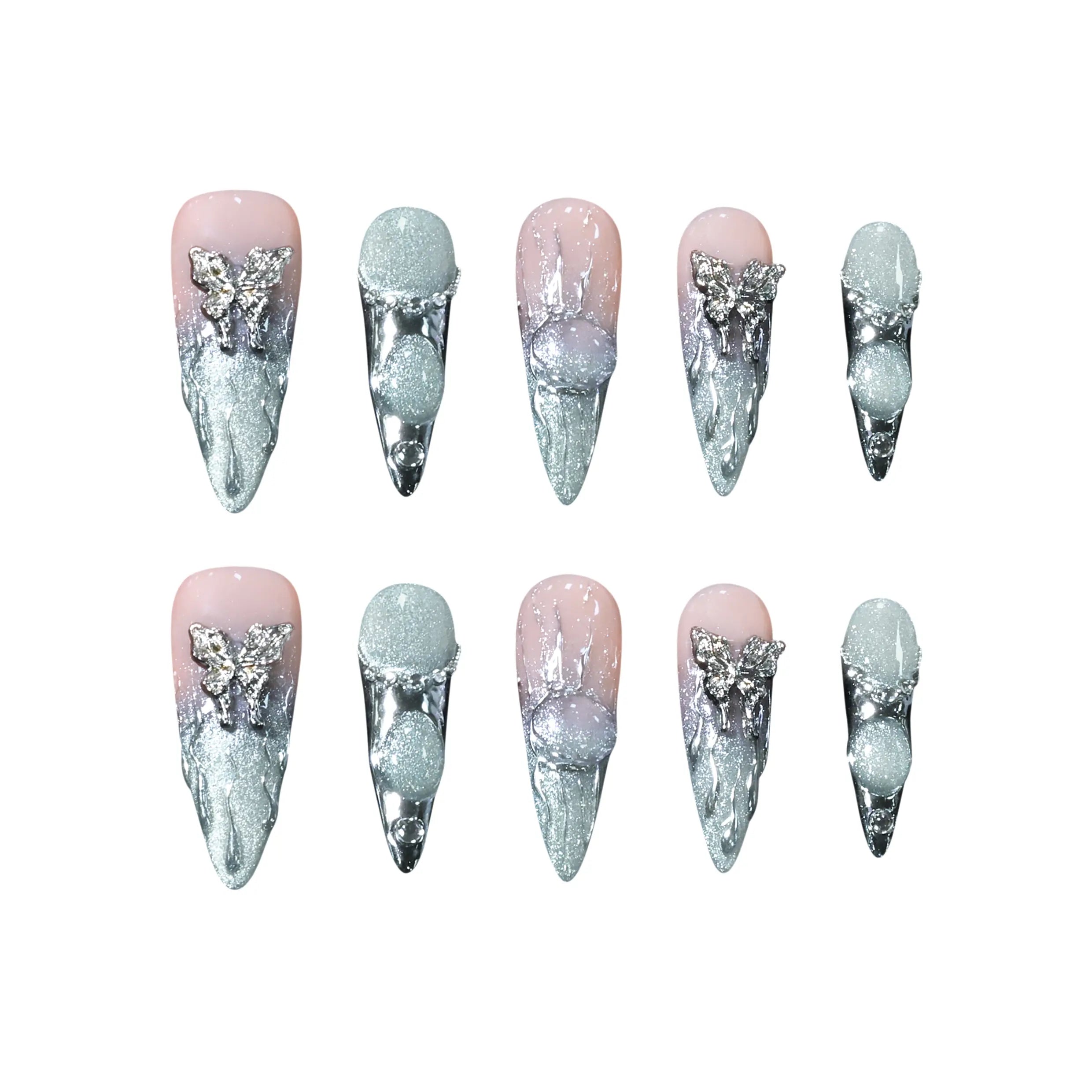 Pink stiletto-shaped press-on nails blending into silver chrome, with 3D ice textures, pearls, and metallic butterfly accents.