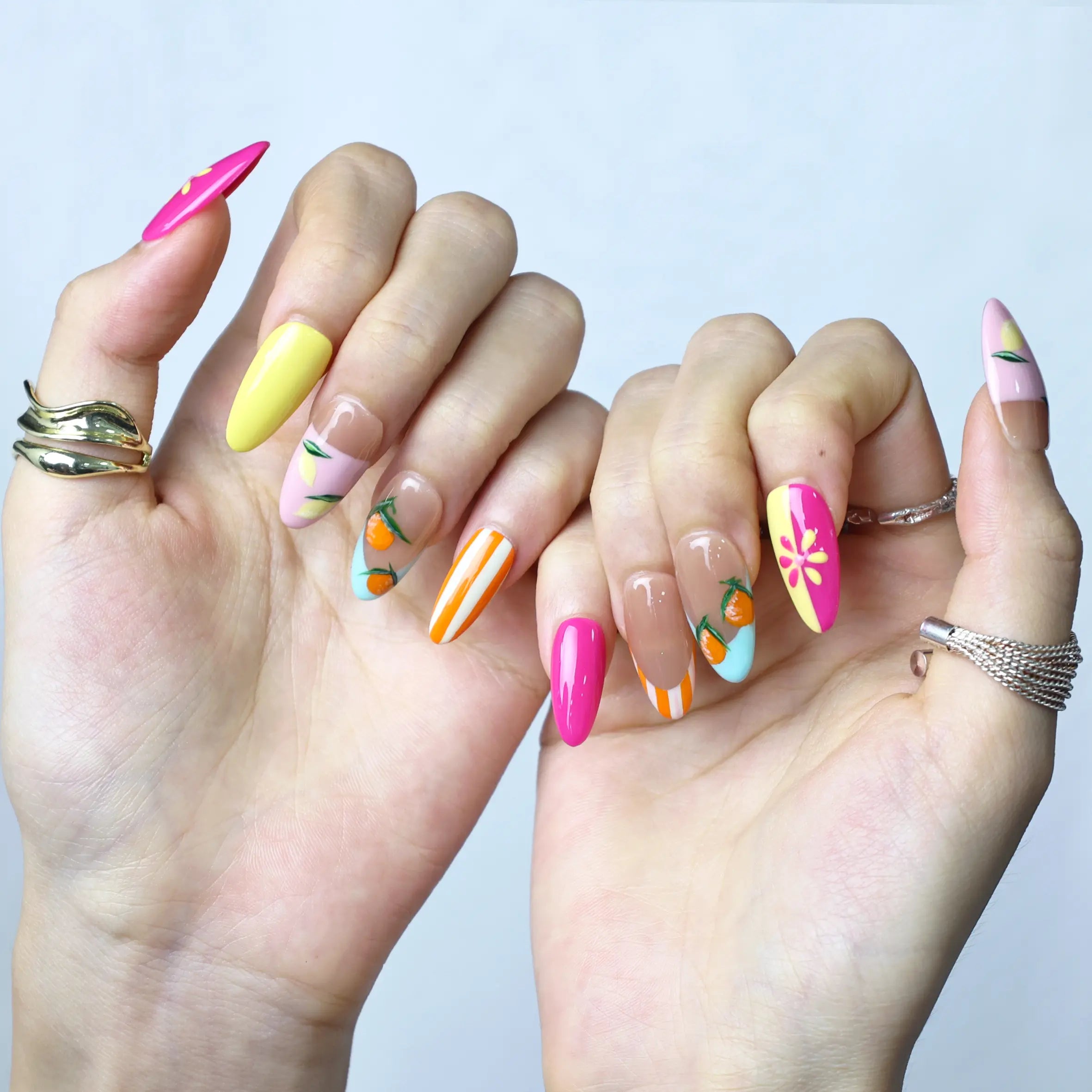 Fresh and playful almond nails with fruit illustrations, ideal for tropical and vacation looks
