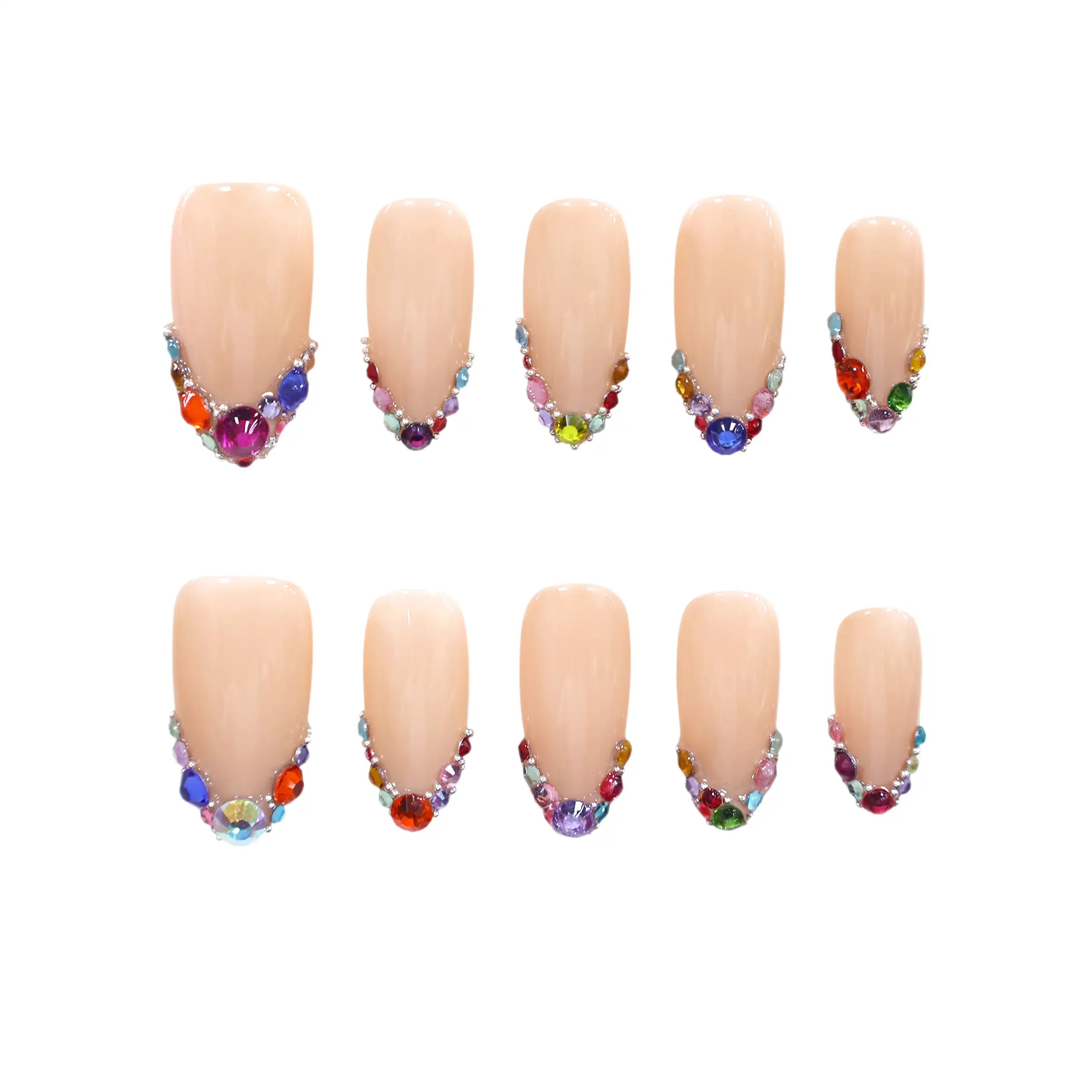 Almond press on nails with nude base and colorful rhinestone tips.