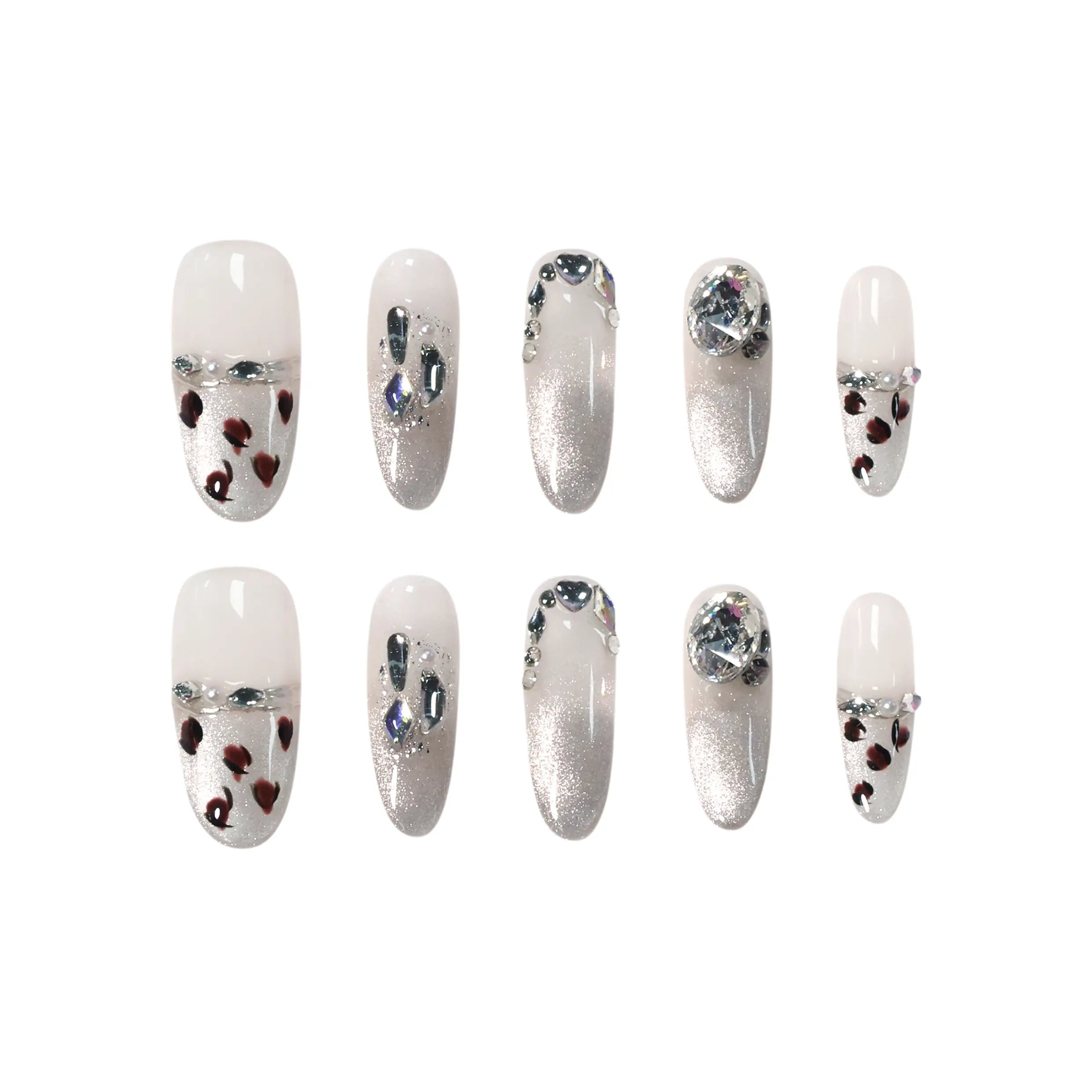 Long oval press on nails with sheer base, silver glitter ombré, and heart-shaped leopard spot accents for a bold summer glam style