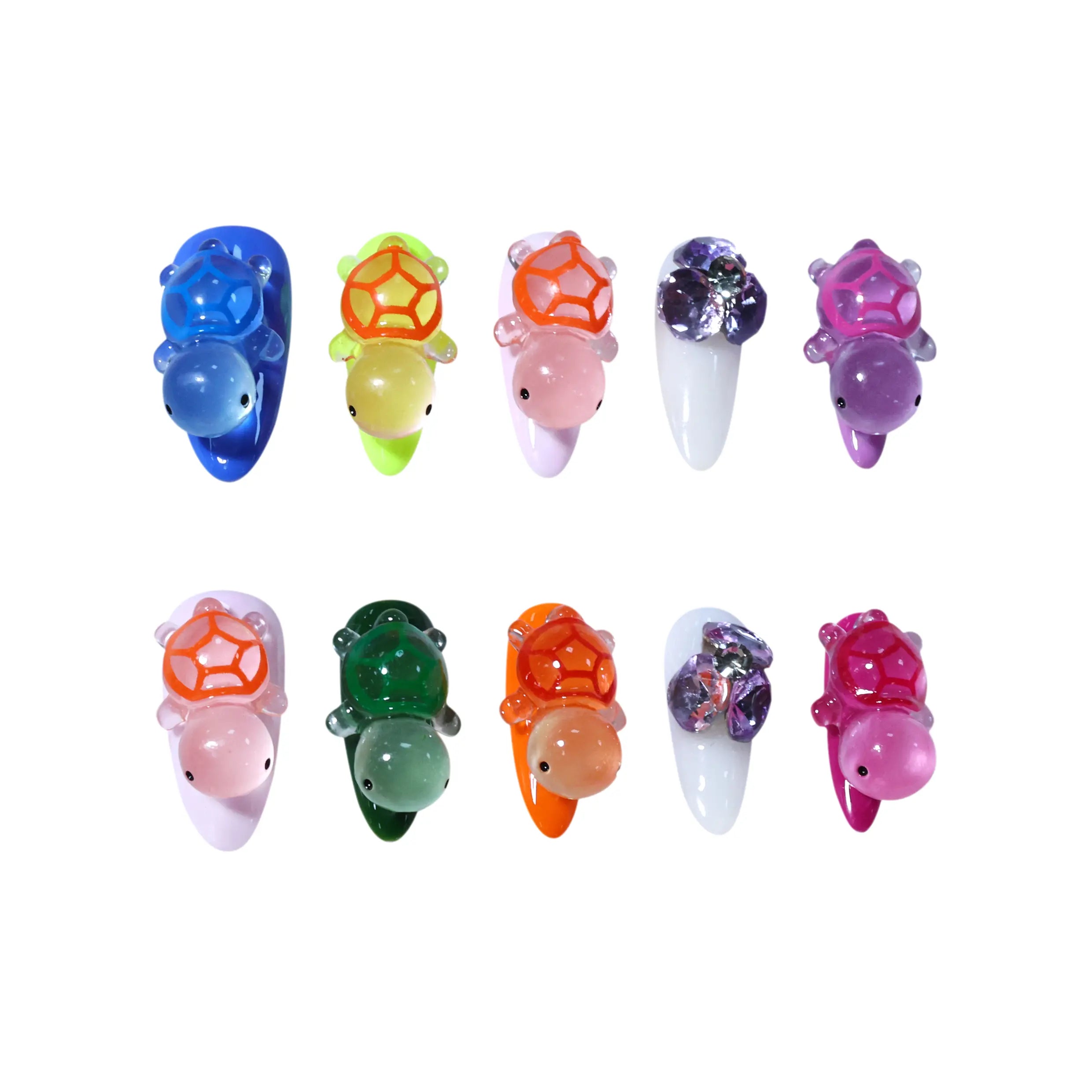 Colorful long almond press on nails featuring 3D turtle charms in blue, green, pink, and orange with crystal accent designs.
