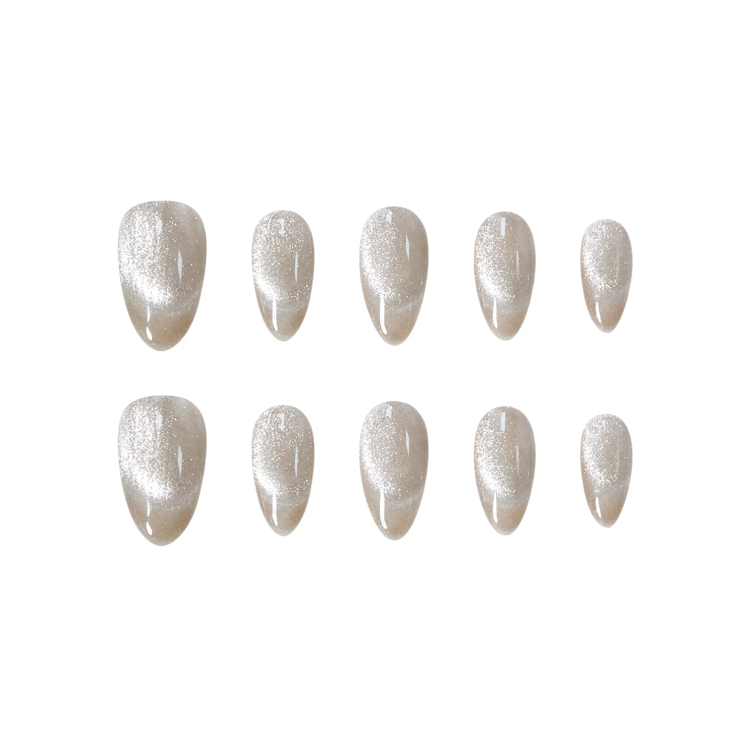 Golden champagne almond press-on nails with a soft cat-eye shimmer effect in medium length.