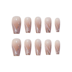 Medium coffin nude pink press-on nails with white French diagonal tips and silver glitter accents.