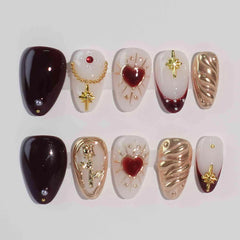 Red almond press-on nails with gold hearts and royal accents, perfect for Valentine’s or romantic evenings.