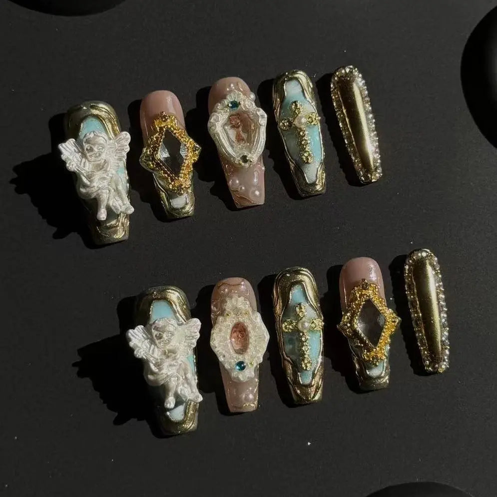 Baroque-style long coffin nails with gold carvings, turquoise gems, and 3D cameo portraits, perfect for high-fashion looks.