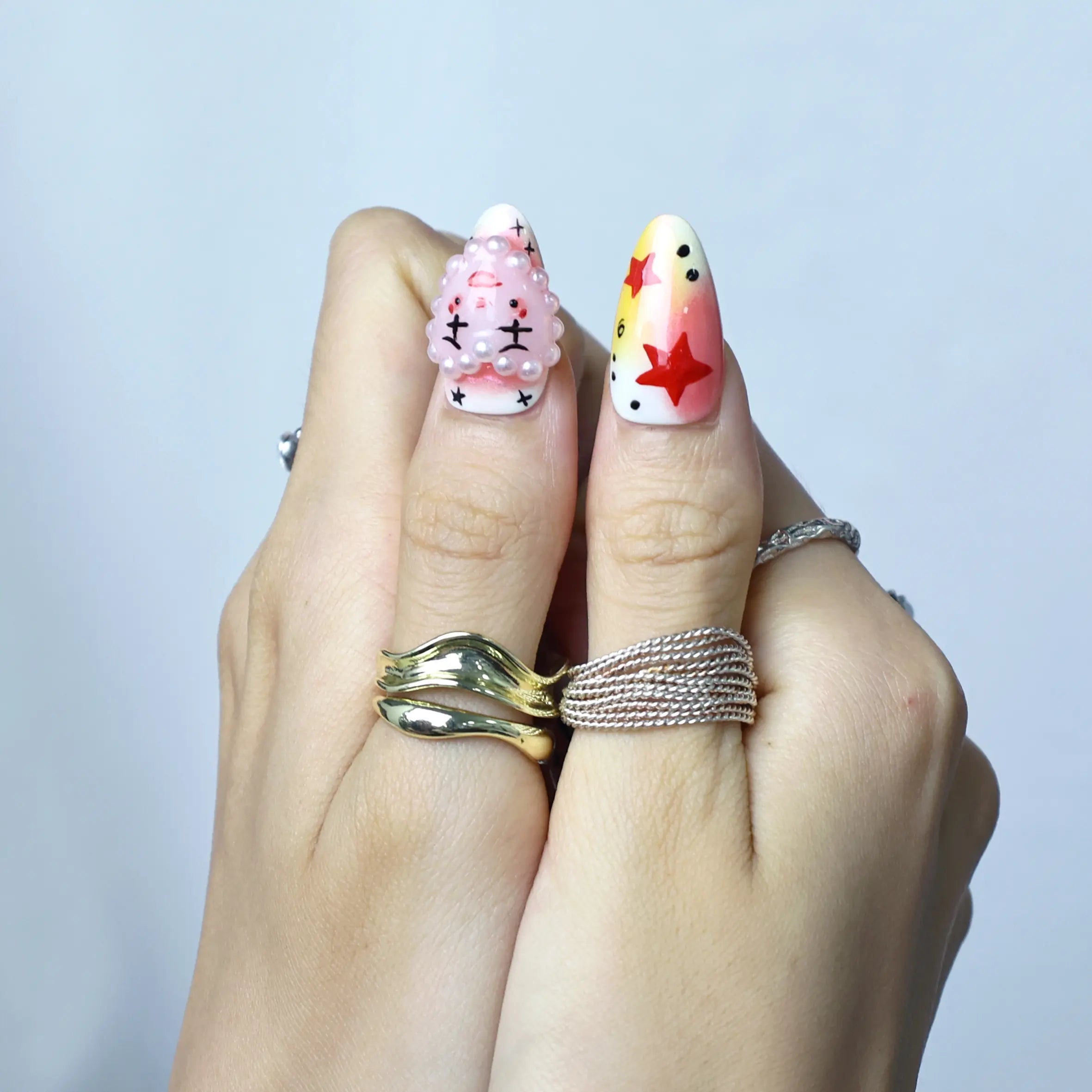 Bold and cute press-on nails with playful eyes and 3D accents, perfect for summer festival vibes