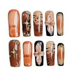 Coffin-shaped long press on nails in mocha tones with 3D pink flowers and tiger stripe accents.
