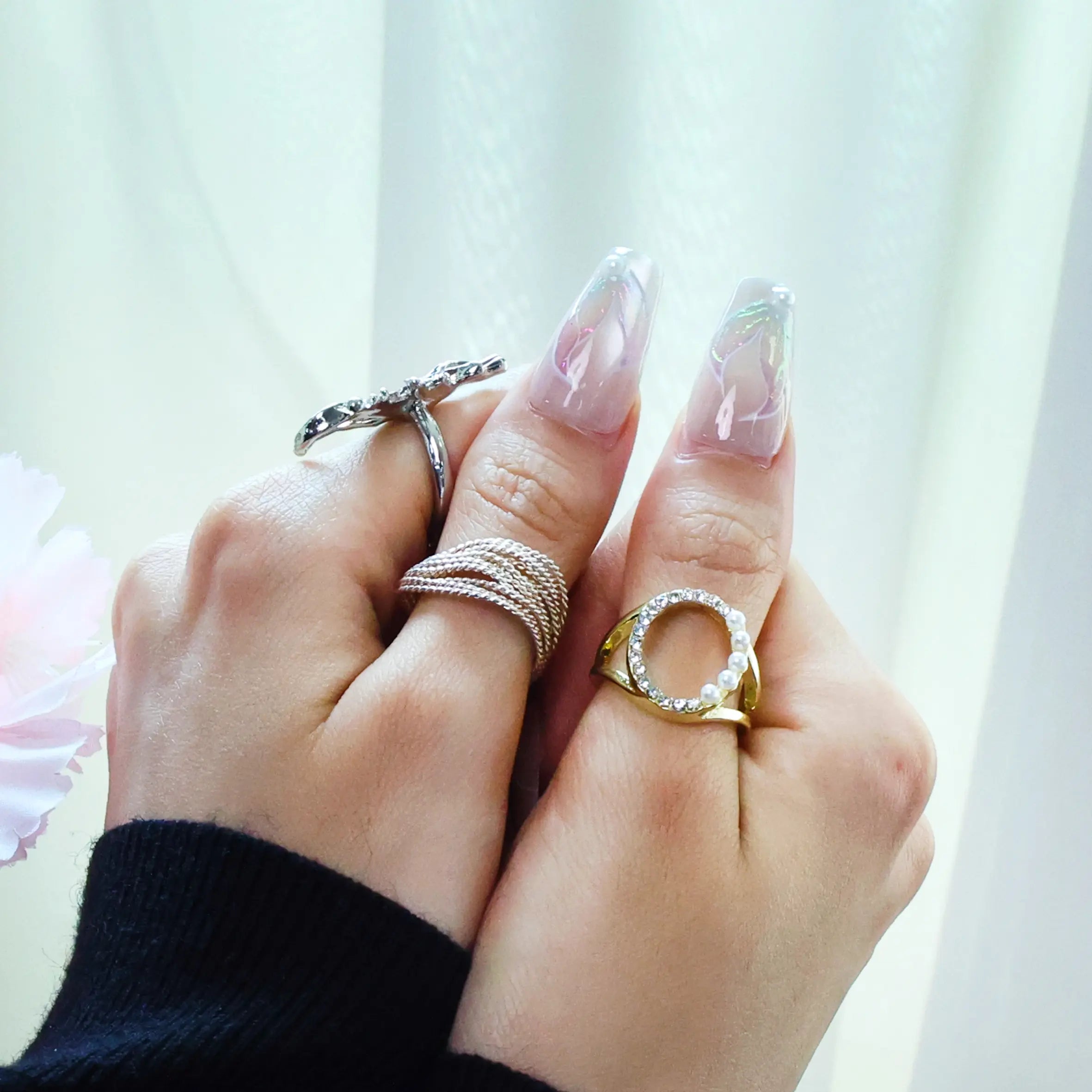 Playful summer nail set with soft gradients and marine accents worn by model