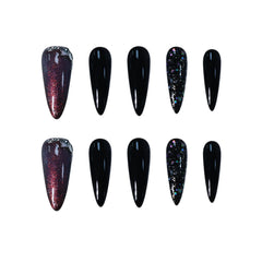 Long black stiletto press-on nails with red glitter and galaxy sparkle accents, inspired by the night sky.