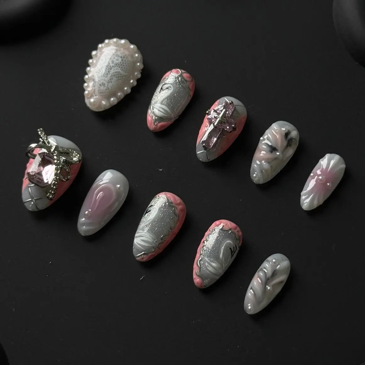 Medium metallic almond press on nails with gradient shimmer, and pearl accents.