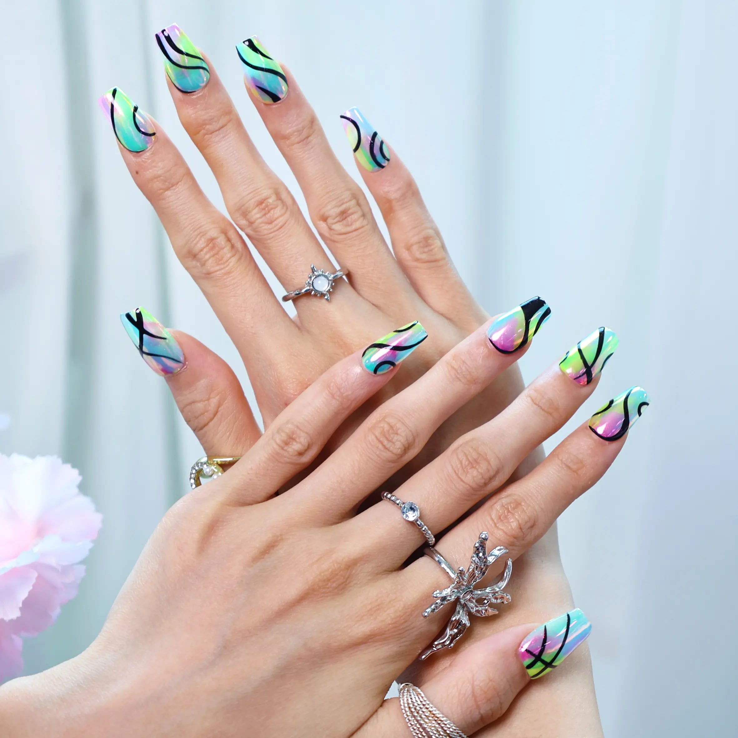 Medium squoral nails in shifting green-purple reflective tones