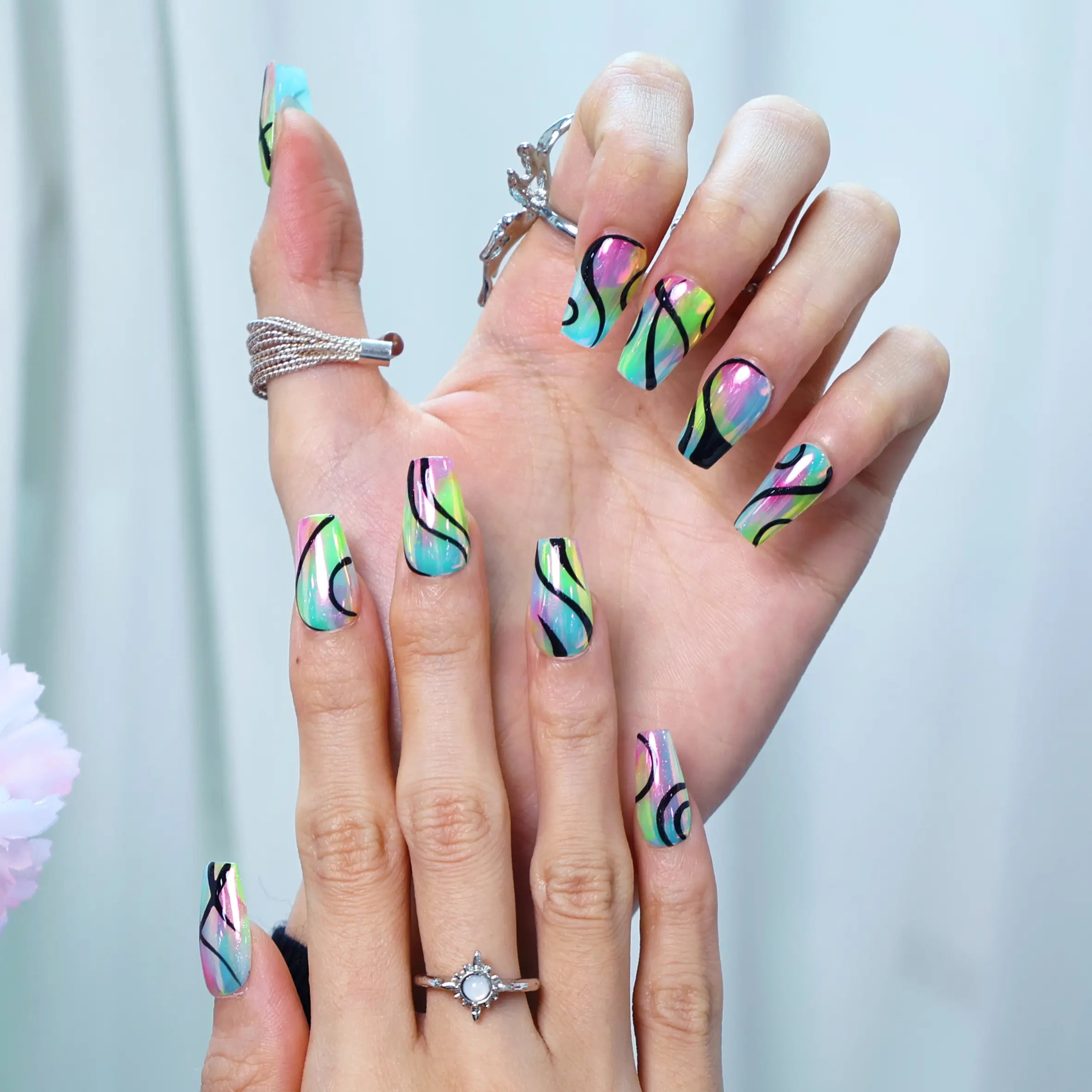 Bold handmade neon nails with cosmic marble texture