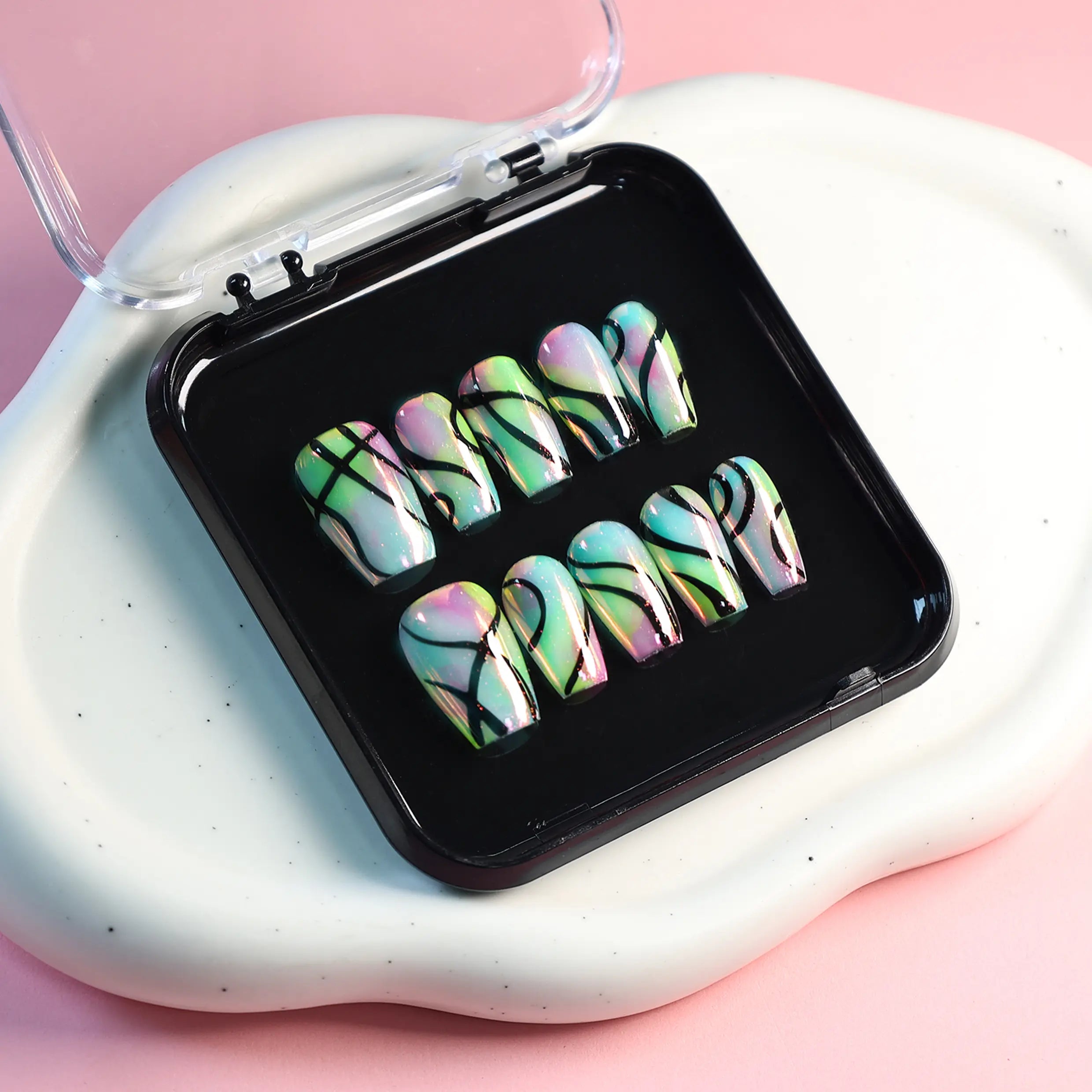 Layout of neon press-ons in vibrant trippy patterns