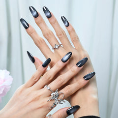 Shimmering black handmade nails with a modern, fierce vibe