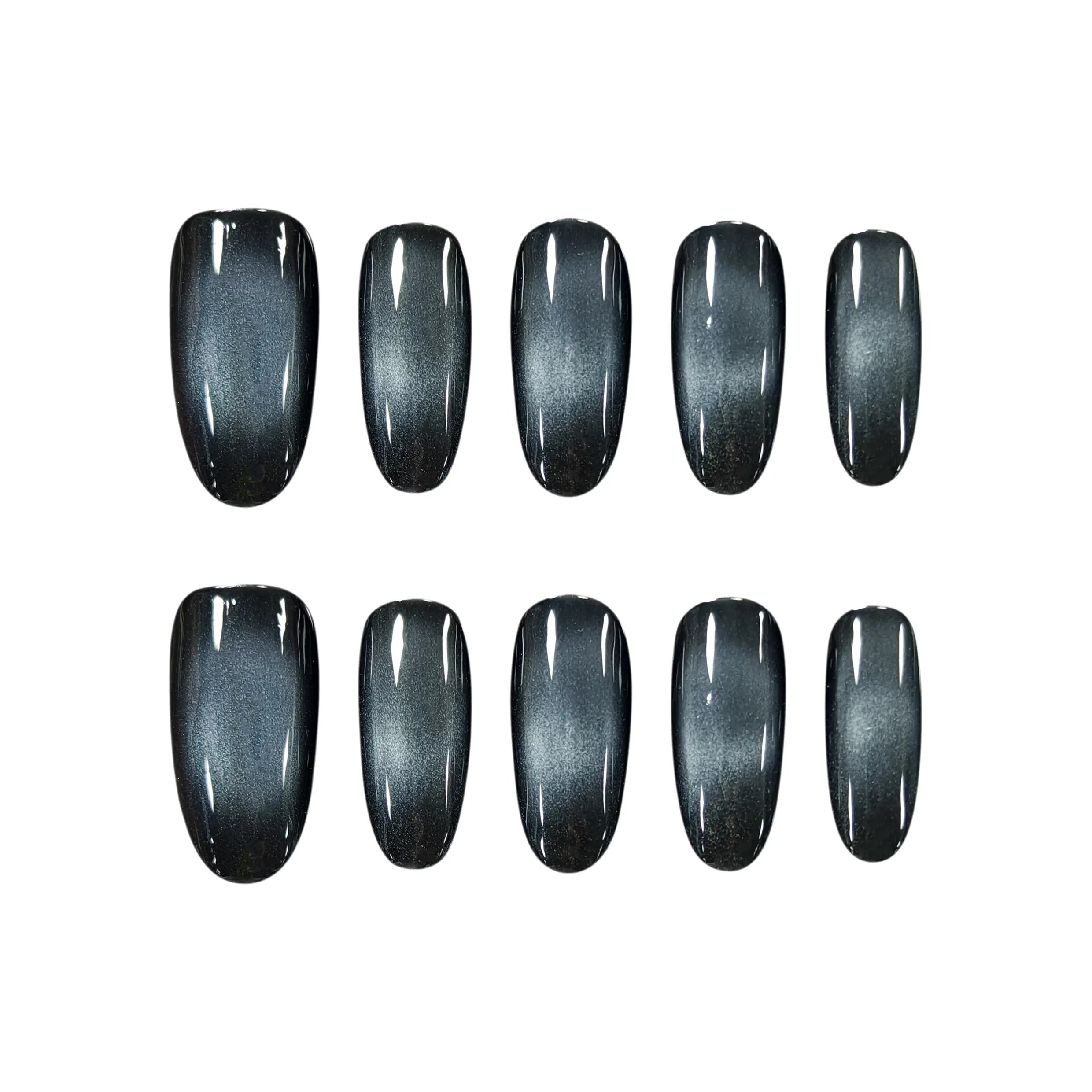 Medium squoval press on nails in black and silver gradient with a sleek, edgy finish for minimalist glam.