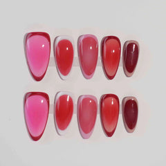 Gradient pink almond press on nails with seamless ombré from soft rose to bold ruby.