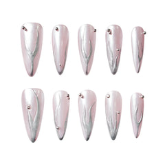 Pink and silver chrome stiletto press on nails with a minimalist futuristic look.