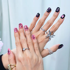 Short handmade pink press-on nails with colorful funky designs