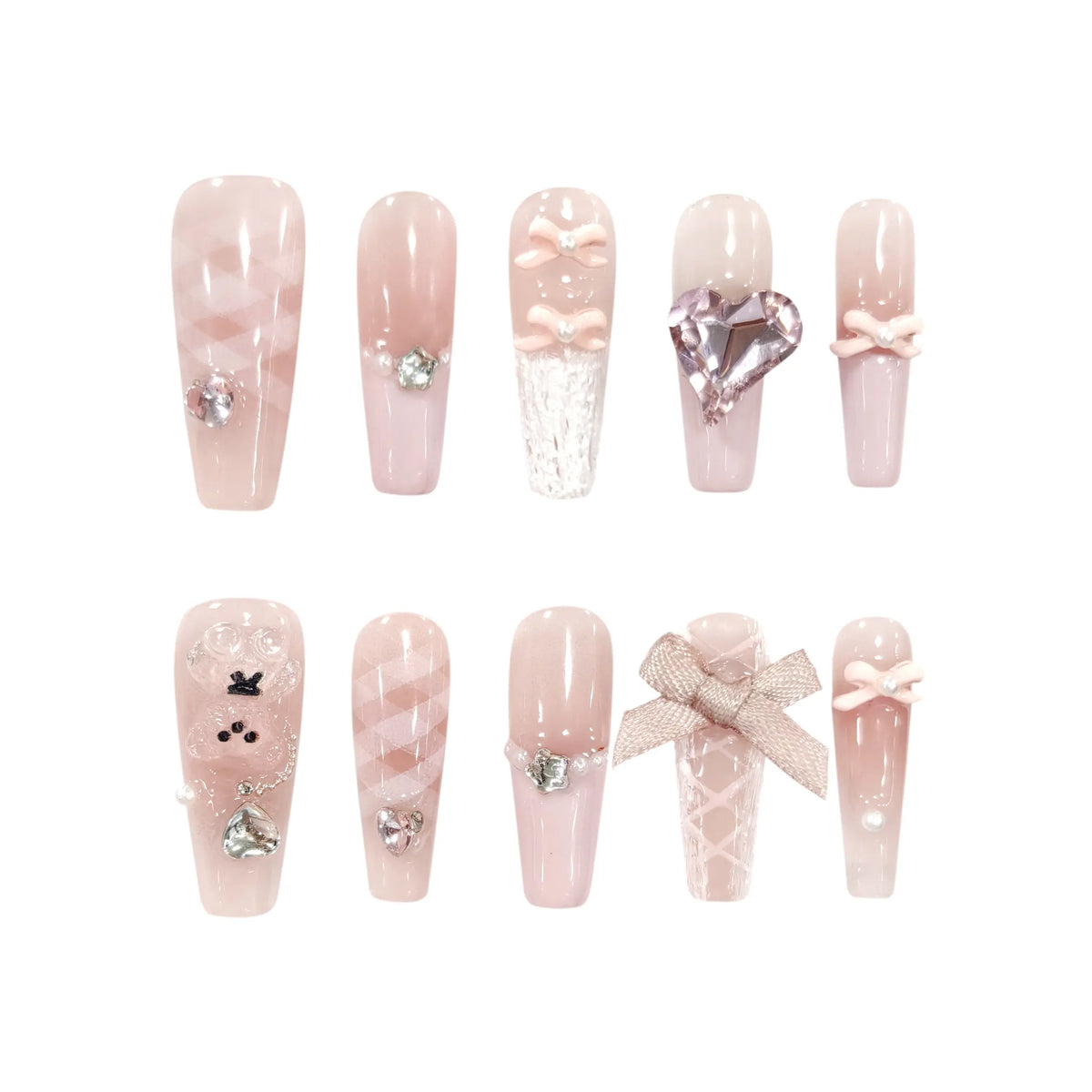 Long coffin-shaped press-on nails in blush pink with delicate bows, shimmering pearls, sparkling rhinestones, and satin ribbon for a romantic, vintage aesthetic
