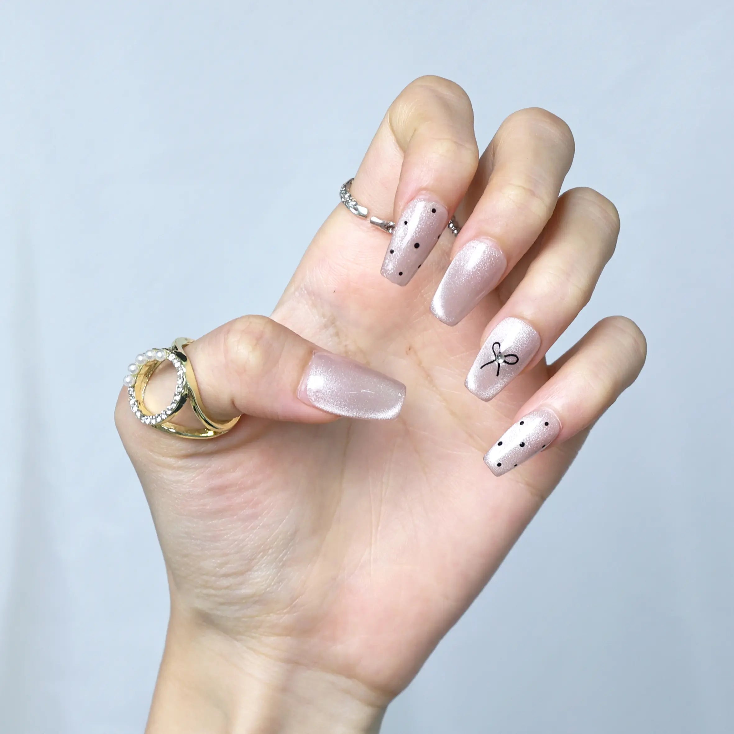 Vintage-inspired blush nails with a modern twist