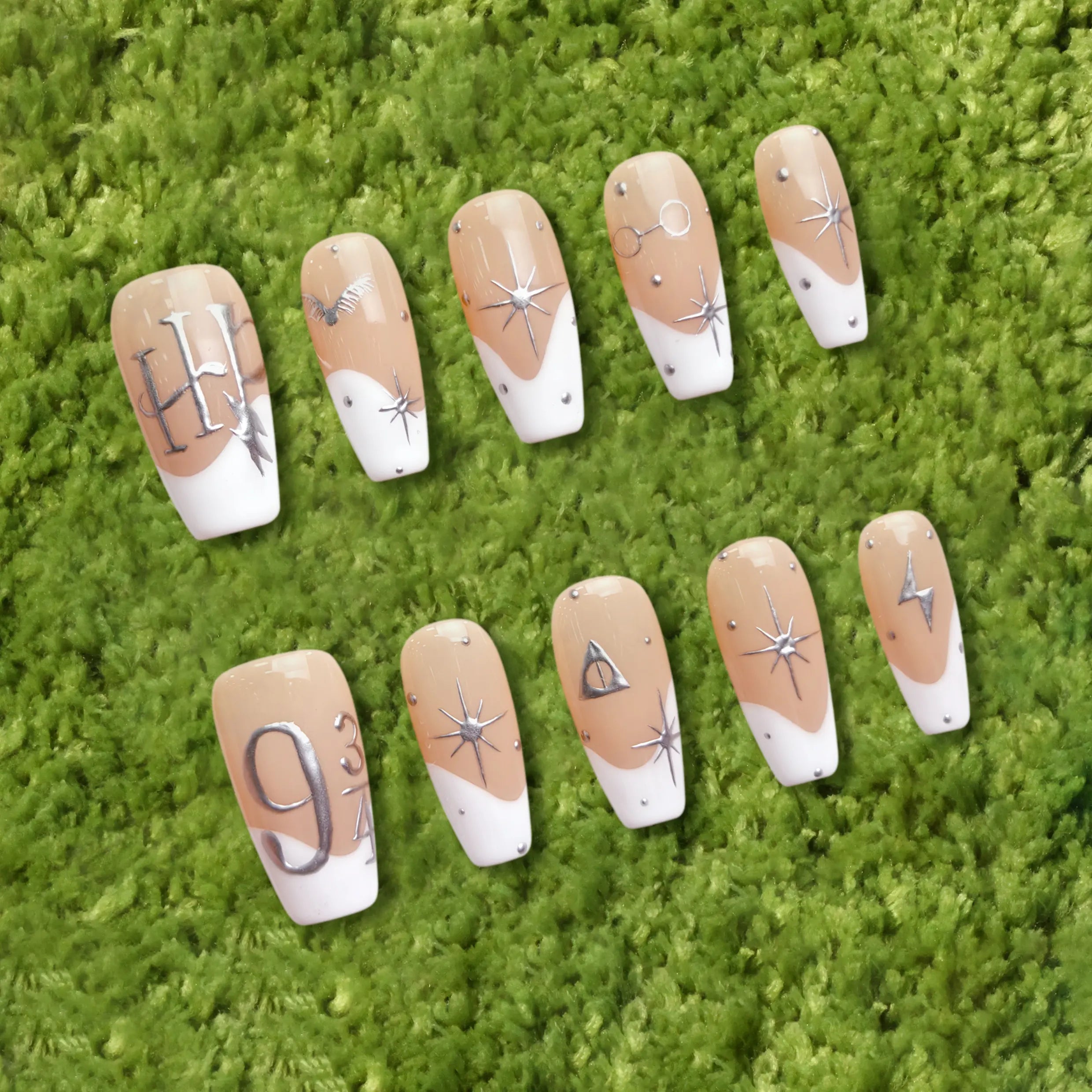 Full product display showing astrology-themed nude coffin nails with silver accents and stars