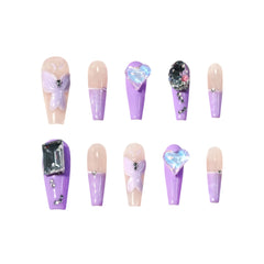 Purple Passion long coffin press-on nails featuring a glossy nude and lavender purple color block design with 3D butterfly accents, heart-shaped gems, and rhinestones
