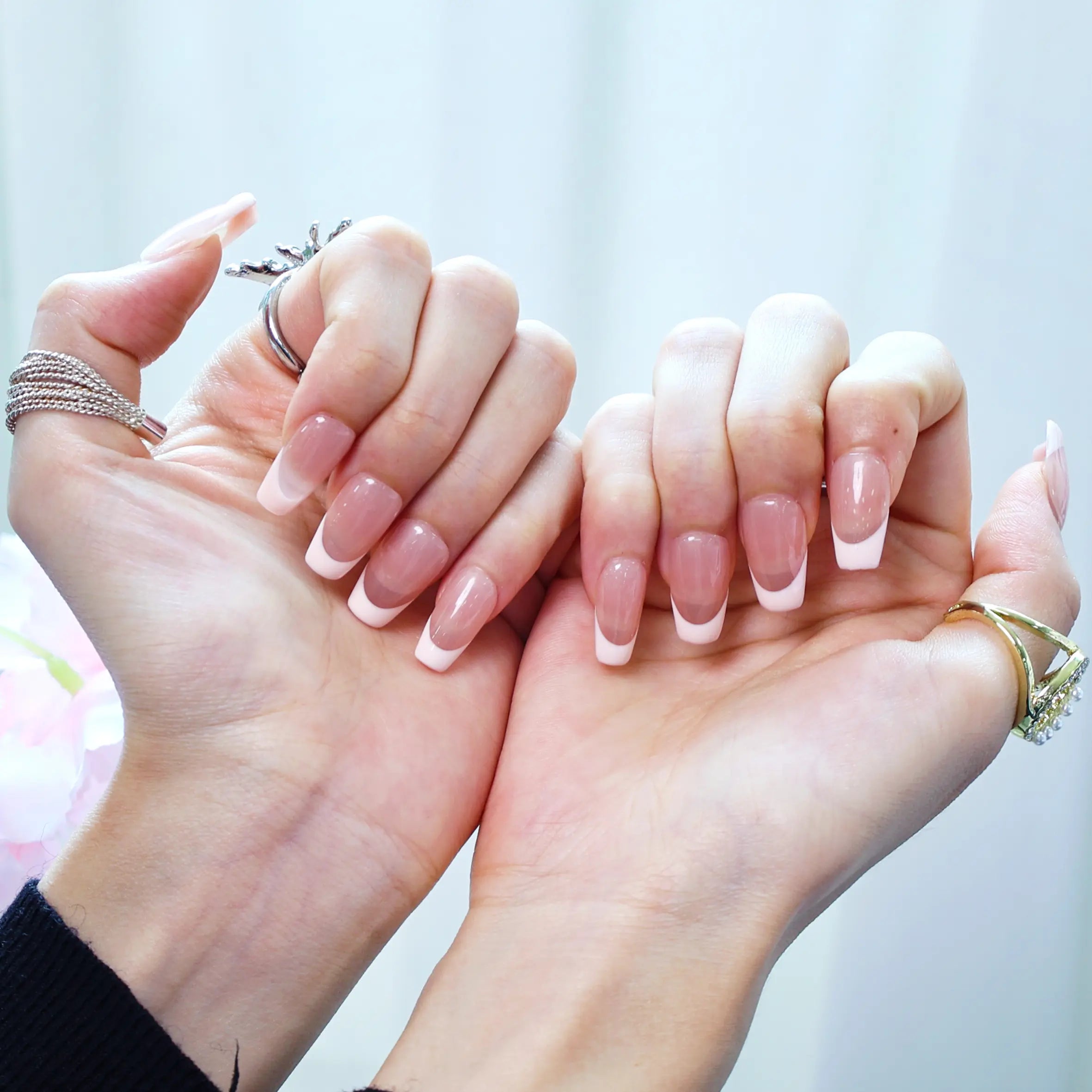 Pink French tip nails on nude base for soft romantic style