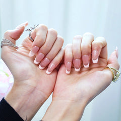 Pink French tip nails on nude base for soft romantic style