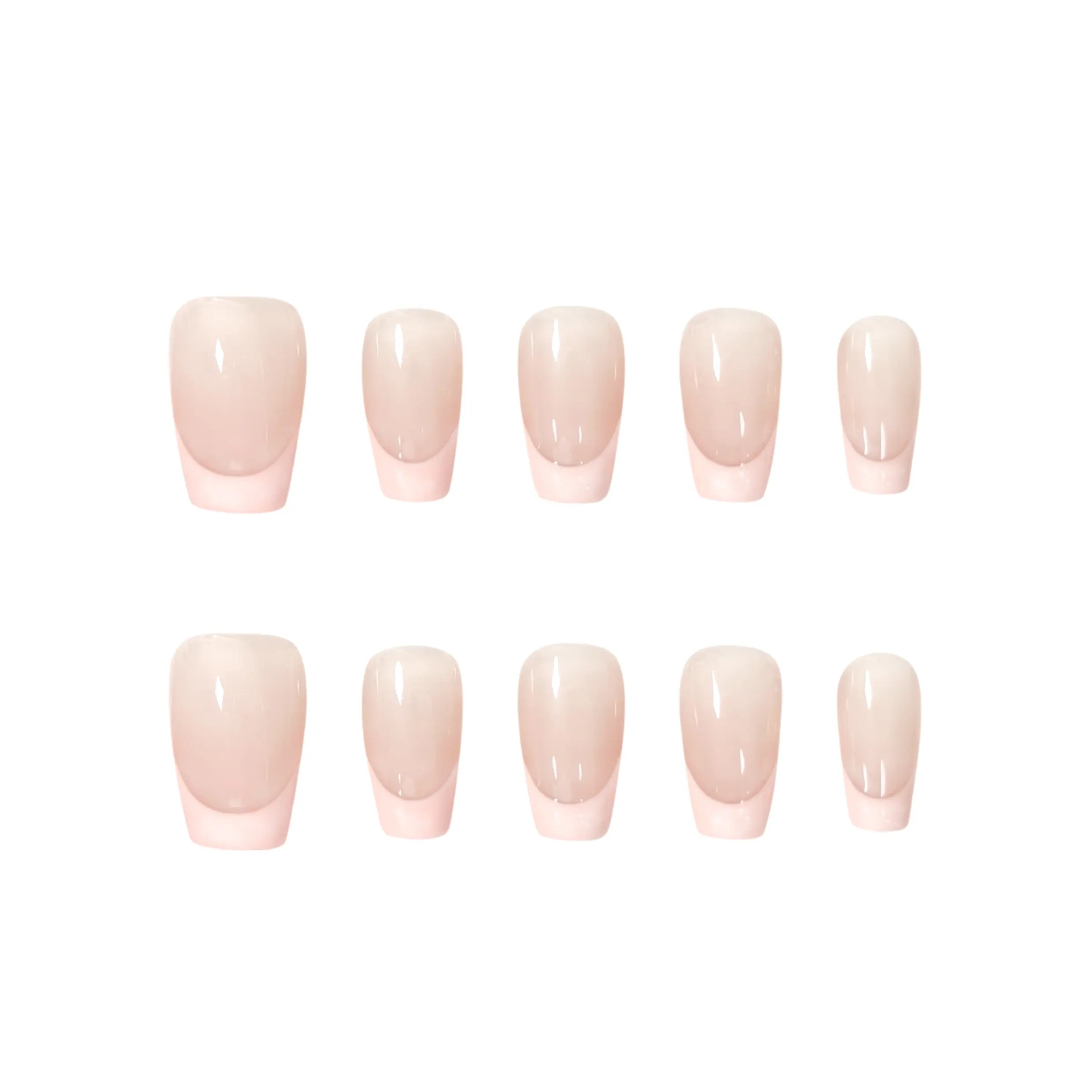 Handmade press-on nails with nude base and soft pink French tips in a modern, romantic style. Ideal for weddings, daily wear, or special occasions