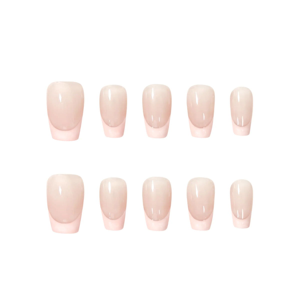 Handmade press-on nails with nude base and soft pink French tips in a modern, romantic style. Ideal for weddings, daily wear, or special occasions