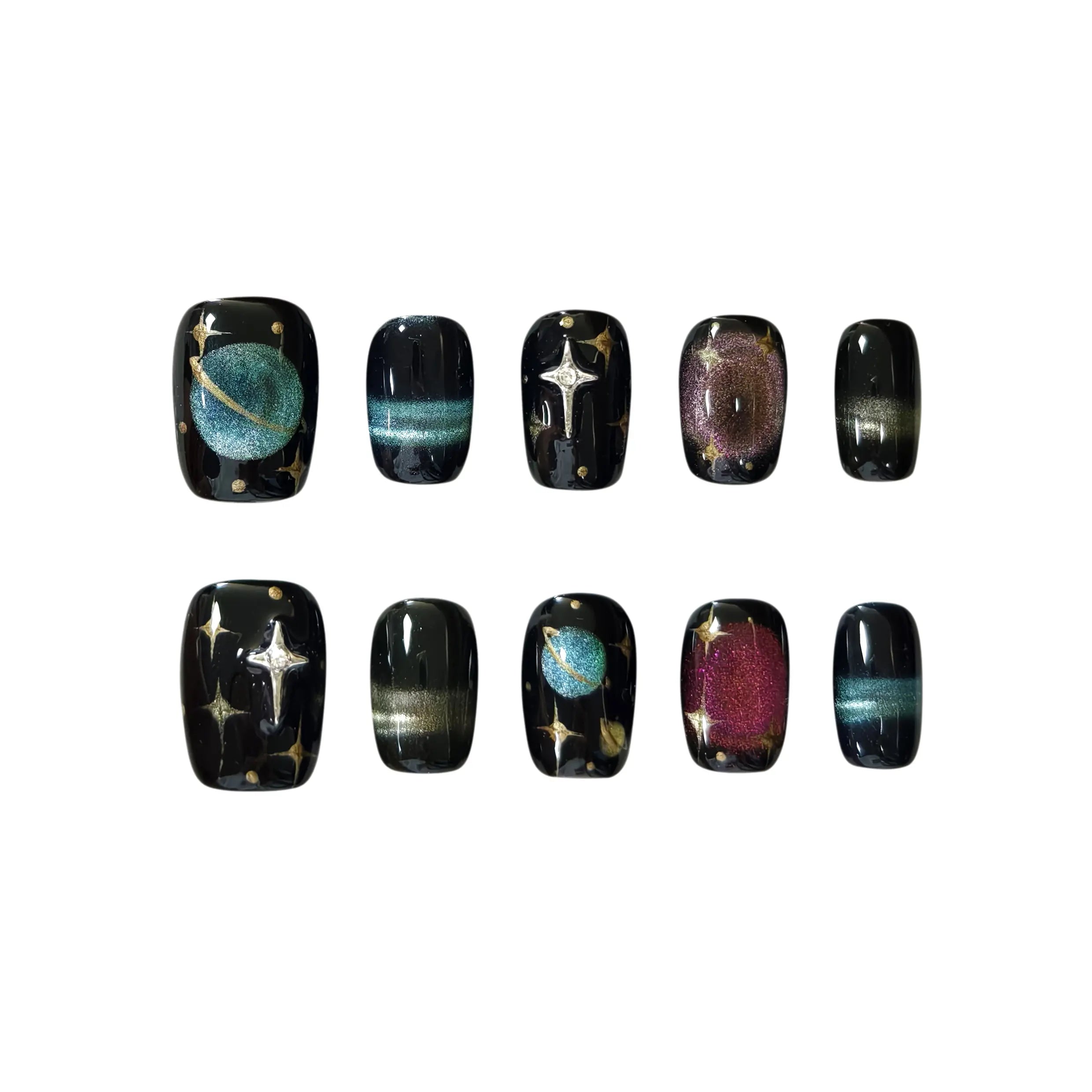 Short squoval black press-on nails with shimmering stars, metallic planets, and magnetic cat-eye auroras, inspired by the night sky