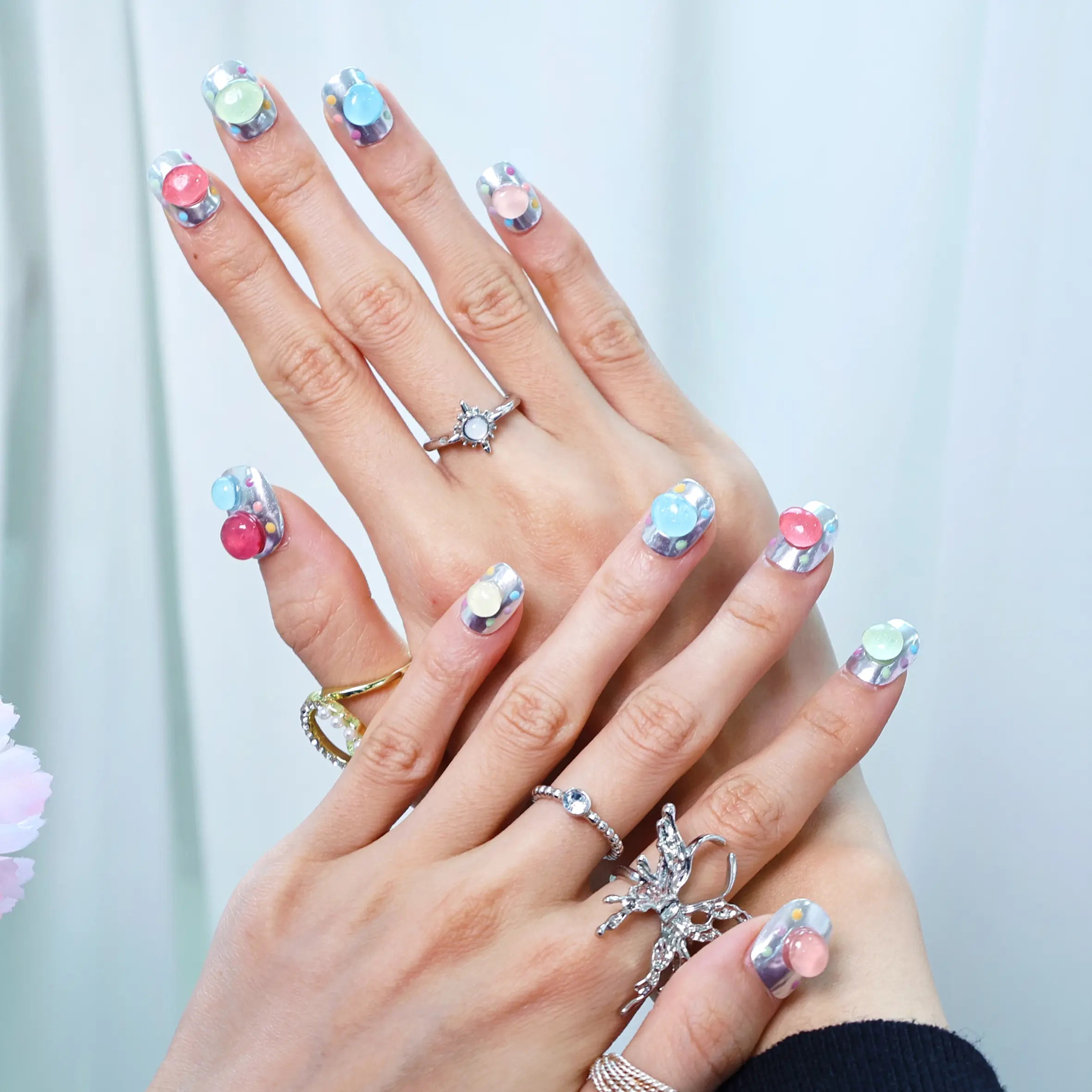 Short chrome press-on nails with colorful jelly bubble accents
