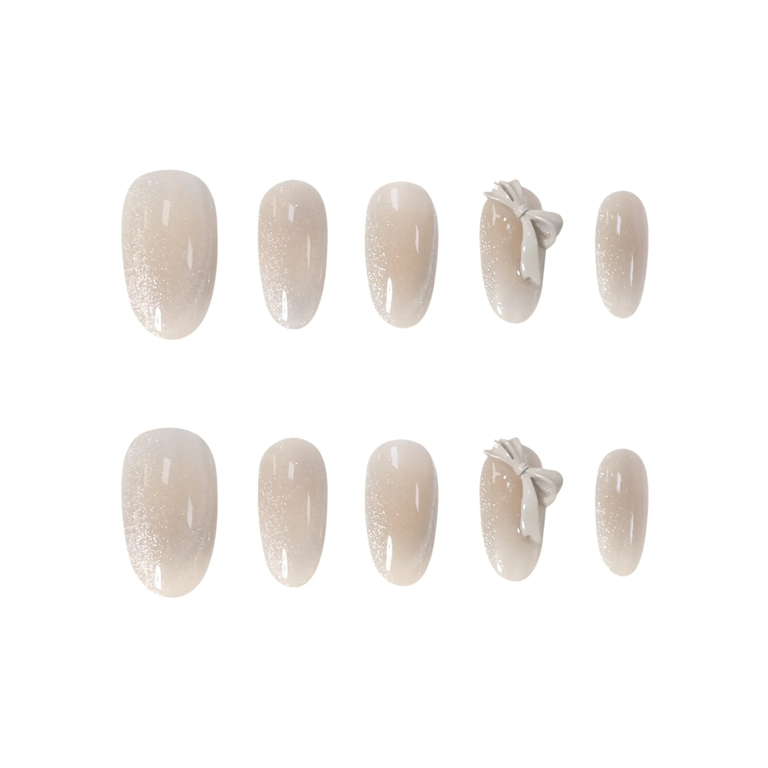 Medium oval nude press-on nails with 3D bows and subtle glitter accents, perfect for summer elegance and daily glam.