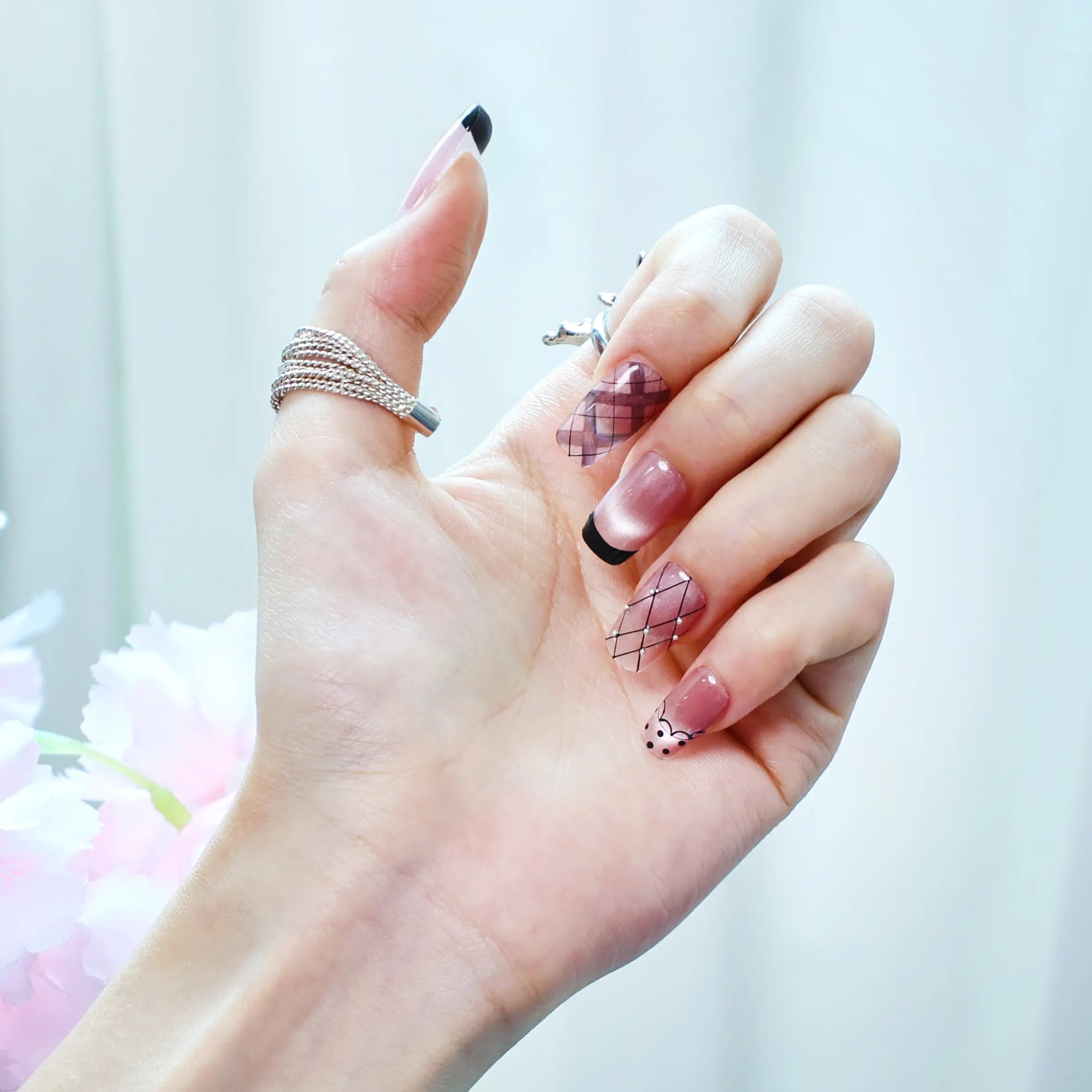 Close-up of velvet-inspired nail design with handmade squoral tips