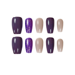 Handmade medium squoval press on nails in violet, lavender glitter, and nude tones for a soft glam summer manicure