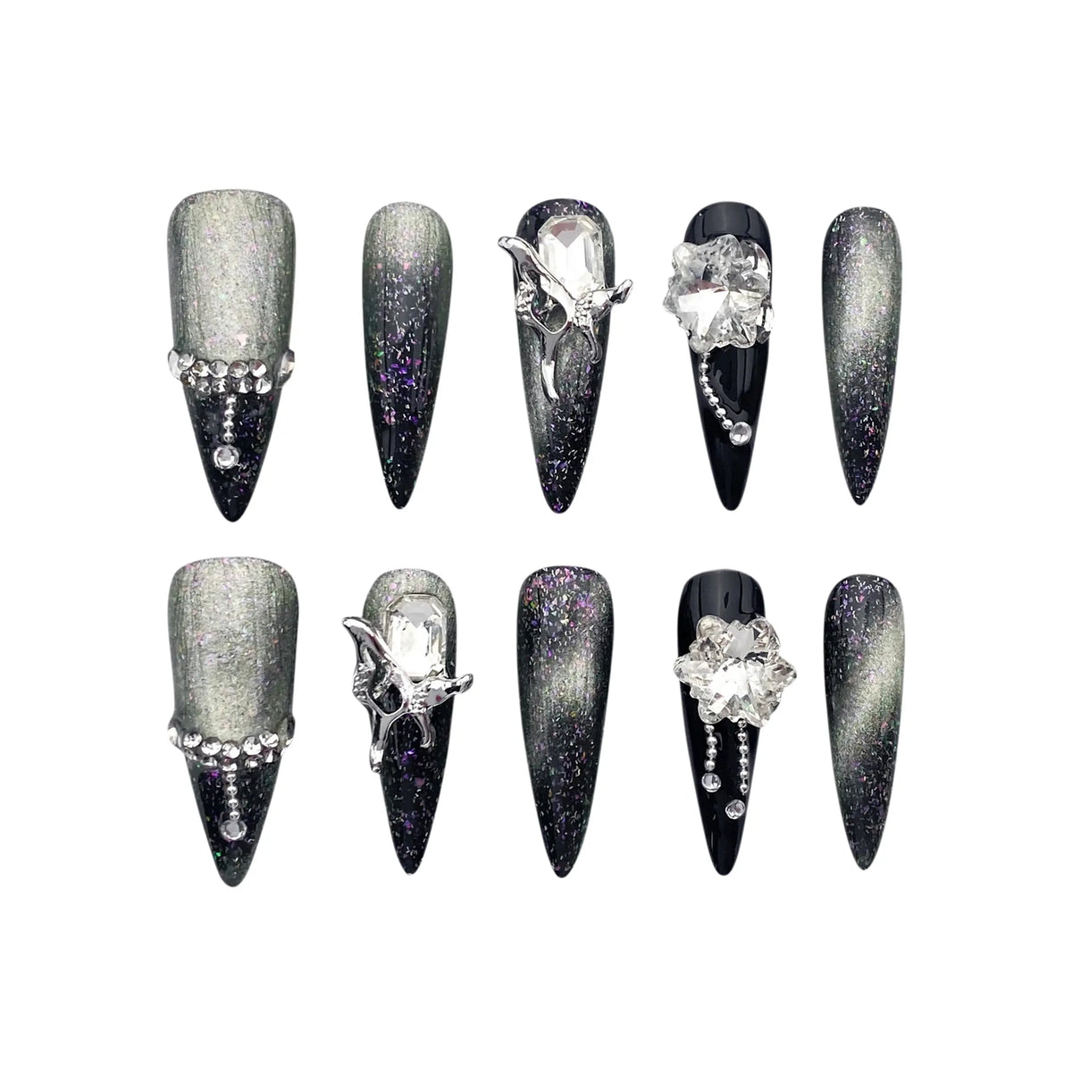 Long black stiletto press on nails with holographic chrome finish and crystal gemstone embellishments.